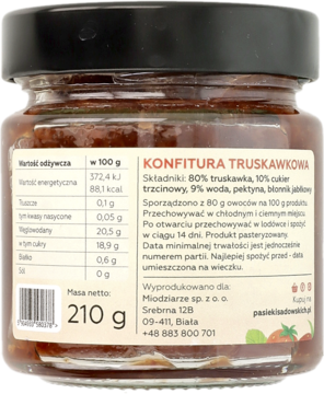 Tył słoika konfitury truskawkowej 210g z czarną nakrętką, widoczna etykieta ze składnikami i wartościami odżywczymi.