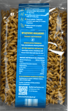 Tył przezroczystego opakowania bezglutenowego makaronu fusilli Healthy Food Park. Brązowo-pomarańczowe spiralki, niebieska etykieta.