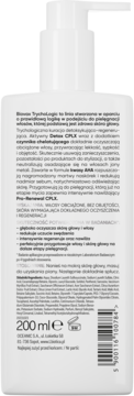 Tył białej butelki szamponu L'biotica Biovax Trychologic, z widocznym tekstem o działaniu detoksykująco-regenerującym.