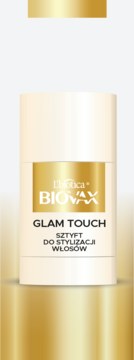 Biovax Glam Touch sztyft do włosów wygładzający w kremowo-złotym opakowaniu, widok z przodu na złotym tle.