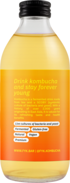 Tył butelki Kombucha Forever Young z sokiem yuzu. Etykieta opisuje żywe kultury bakterii probiotycznych.