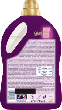 Tył fioletowej butelki płynu Silan Aromatherapy Magic Magnolia z białym uchwytem, widoczne instrukcje i kod kreskowy.