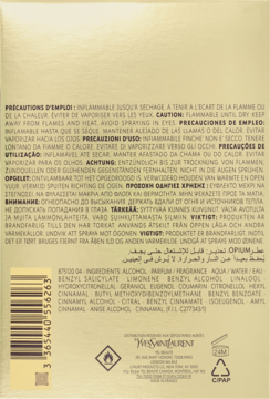 Tył złotego opakowania perfum YSL Opium, widoczne ostrzeżenia i lista składników, barcode.