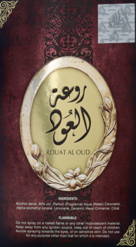 Czerwono-złote opakowanie perfum Rouat Al Oud z arabskimi napisami i ozdobną, złotą etykietą.