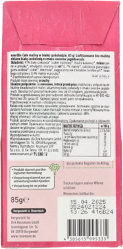 Tył różowego opakowania czekolady emerBio Całe Maliny w Białej Czekoladzie 85g, widoczny tekst i kod kreskowy.