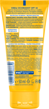 Tył żółtej tubki kremu ochronnego Dax Sun SPF 30. Widoczny skład, instrukcje i kod kreskowy.