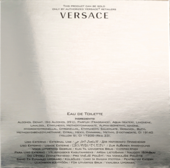 Tył srebrnego, błyszczącego opakowania Versace Eros Eau de Toilette, z czarnym logo i składem produktu.