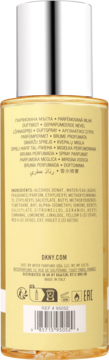 Tył złotej mgiełki perfumowanej DKNY, z etykietą, listą składników i kodem kreskowym, srebrny atomizer.