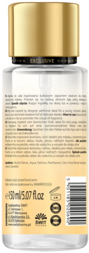 Tył przezroczystej butelki mgiełki do ciała Exclusive Cosmetics ze złotą nakrętką, instrukcje i skład na etykiecie.