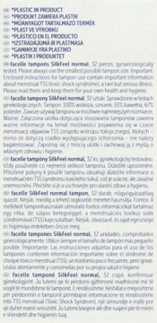 Biała etykieta z czarnym tekstem, wielojęzyczne informacje o tamponach Facelle Silk Feel normal, TSS.