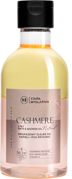 Butelka dwufazowego olejku do kąpieli Stara Mydlarnia Cashmere, różowo-żółty płyn, czarna nakrętka, widok z przodu.