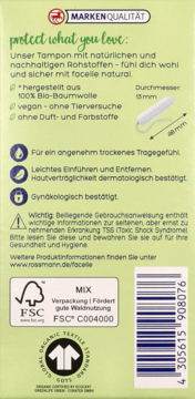 Tył opakowania tamponów Facelle Natural. Zielone tło, tekst po niemiecku, certyfikaty FSC i bawełny bio.