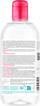 Tył przezroczystej butelki płynu micelarnego Bioderma Sensibio H2O do skóry wrażliwej, z różową nakrętką i opisem.