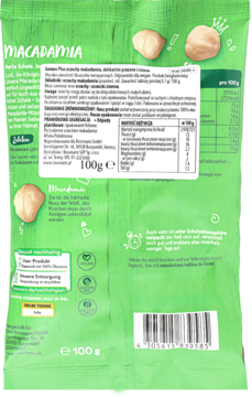 Tył zielonego opakowania orzechów Macadamia 100g, z tabelą wartości odżywczych i opisem w j. niemieckim.