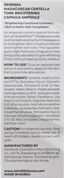 Białe opakowanie SKIN1004 Madagascar Centella Tone Brightening Ampoule, tył z czarnym tekstem składników i użycia.