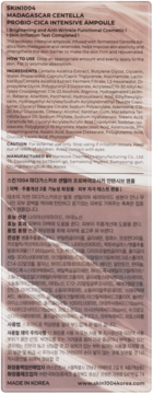 Tył opakowania SKIN1004 Probio-CICA Ampoule. Matowe, beżowo-różowe tło, z informacjami o składnikach po angielsku i koreańsku.