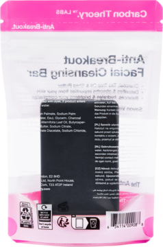 Tył różowo-białego opakowania mydła do twarzy Carbon Theory Anti-Breakout, z czarną kostką mydła i odwróconymi napisami.