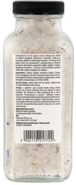 Tył butelki soli do kąpieli Manufaktura Piękna, gruboziarniste kryształki z fioletowymi płatkami.