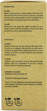 Tył brązowego opakowania organicznego olejku jojoba do skóry i włosów, z instrukcjami i certyfikatami.