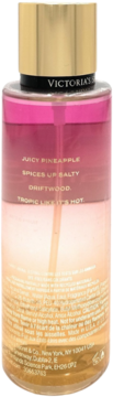Tył mgiełki Victoria's Secret Electric Mango, różowo-pomarańczowy płyn, złoty korek. Widoczne nuty: ananas, przyprawy, drewno, sól.