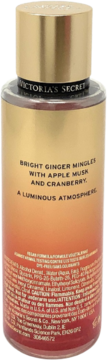 Tył butelki Victoria's Secret Bright Ginger mgiełki zapachowej, z opisem nut: imbir, jabłko, żurawina, piżmo.
