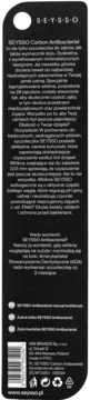 Tył opakowania czarnej manualnej szczoteczki SEYSSO Carbon Antibacterial z białym tekstem i kodem kreskowym.