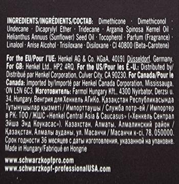 Tył czarnego opakowania olejku do włosów Schwarzkopf Oil Ultime, zbliżenie na składniki i dane producenta w białym tekście.