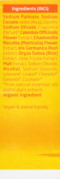 Tył opakowania naturalnego mydła Weleda, ze szczegółową listą składników INCI na żółtym tle.