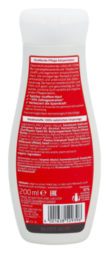Tył białej butelki ujędrniającego balsamu Weleda z organicznymi olejami, widoczna pełna lista składników 200ml.