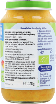 Tył szklanego słoiczka z bio daniem dla niemowląt (ryż i warzywa), pomarańczowa zawartość, zielona nakrętka, biała etykieta.