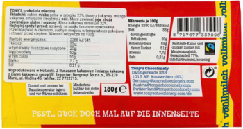 Tył czerwono-żółtego opakowania Tony's Chocolonely, czekolady mlecznej 180g, z danymi odżywczymi i Fairtrade.