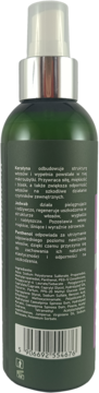 Tył zielonej butelki mgiełki termoochronnej Mysterium do włosów z białym tekstem i srebrnym atomizerem.