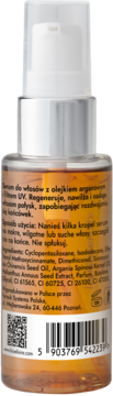 Tył brązowej butelki serum Bioelixire z olejkiem arganowym, etykieta z opisem, składnikami, kodem kreskowym.