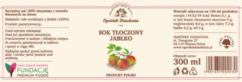 Etykieta soku tłoczonego 100% jabłkowego Ogródek Dziadunia, z ilustracją trzech jabłek i napisem 'SOK TŁOCZONY JABŁKOWY'.