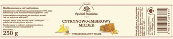 Etykieta miodu cytrynowo-imbirowego Ogródek Dziadunia 250g, z grafiką cytryny i imbiru, na jasnym tle.