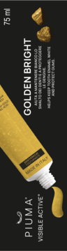 Złota pasta do zębów Piuma Golden Bright 75ml w tubce, wyciśnięta, na czarnym tle, z bryłkami złota.