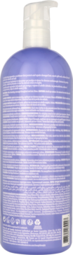 Tył fioletowej butelki odżywki Alterna Caviar Anti-Aging Restructuring Bond Repair z białym pompką i czytelnym tekstem.