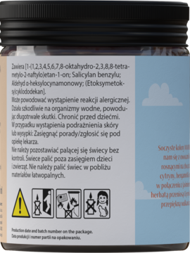 Tył czarnego słoika świecy sojowej Hiskin Mallorca z białą etykietą, listą składników i symbolami ostrzegawczymi.