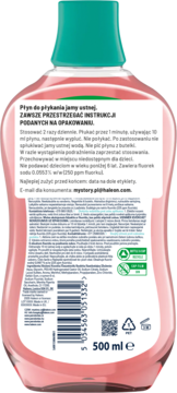 Tył różowego płynu do płukania jamy ustnej 500ml, zielona nakrętka i biała etykieta z polskimi instrukcjami.