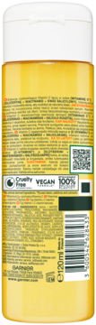 Tył żółtej butelki rozświetlającej esencji Garnier Vitamin C 120ml, z białą nakrętką i etykietą ze składnikami.