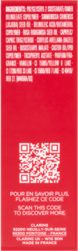 Tył opakowania Clarins Lip Comfort Oil Cherry. Czerwone pudełko z białym tekstem składników, kodem QR, adresem.