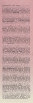 Tył opakowania toniku Anua Peach 77% z instrukcjami użycia w wielu językach, na jasnym, pastelowym tle.