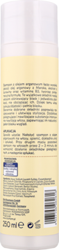 Tył białej butelki szamponu Isana Argan & Żurawina do włosów suchych/zniszczonych. Tekst po polsku, skład.