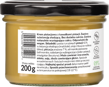 Tył szklanego słoika z kremem pistacjowym crunchy Foods by Ann, czarna nakrętka, polska etykieta bez cukru.