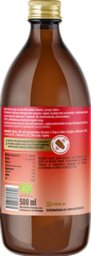 Tył brązowej butelki napoju owocowego z imbirem, czerwona etykieta z listą składników i pojemnością 500 ml.
