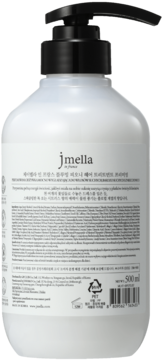 Tył białej butelki JMELLA B.PEONY HAIR TREATMENT 500 ml z czarną pompką i informacjami na etykiecie.
