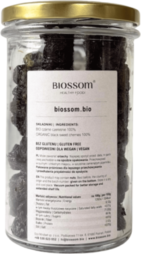 Suszone czarne czereśnie Biossom bio, bez glutenu, w przezroczystym słoiku ze złotą zakrętką, widok z przodu.