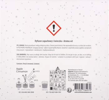 Tył opakowania zestawu dyfuzora i świeczki Apple Cinnamon, widoczne ikony ostrzegawcze i instrukcje.