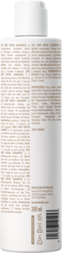 Tył białej butelki Heö Helsinki Detox Shampoo, widoczne opisy, skład, 300 ml i symbole recyklingu.