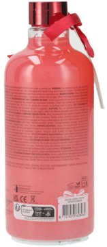 Sence Light Up Bath Foam żurawinowy, tył różowej butelki z etykietami, kodem kreskowym i czerwoną wstążką.